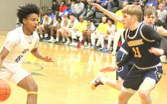 Luke Caputo/Kitsap News Group photos
Charlie Hill of Bainbridge guards Jaydon Turner of Bremerton during a district semifinal game Feb. 21 at Foss High School.