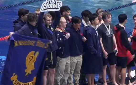 Luke Caputo/Kitsap News Group
The Bainbridge Spartans celebrate their state victory at the 1A-2A swimming championships at the King Aquatic Center Feb. 22.