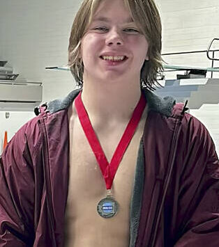 South Kitsap High School courtesy photo
SK senior diver Karter Warner wearing his 2nd place state medal.