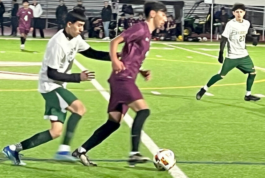 <p>Luke Caputo/Kitsap News Group photos</p>
                                <p>SK midfielder Yuji Ehret dribbles the ball down the field in a 3-1 loss to the Evergreen Wolverines March 12 at South Kitsap High School.</p>