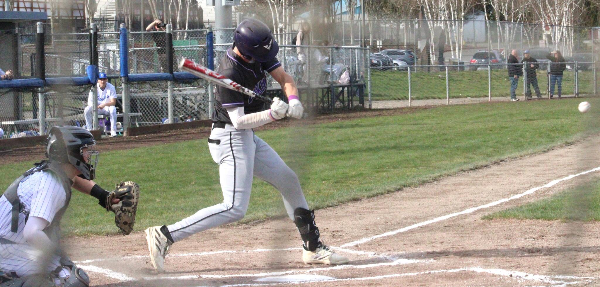 Luke Caputo/Kitsap News Group photos
Viking Spencer Gillespie swings at a pitch in a 13-6 North Kitsap win over the Olympic Trojans March 26 at the Kitsap County Fairgrounds.