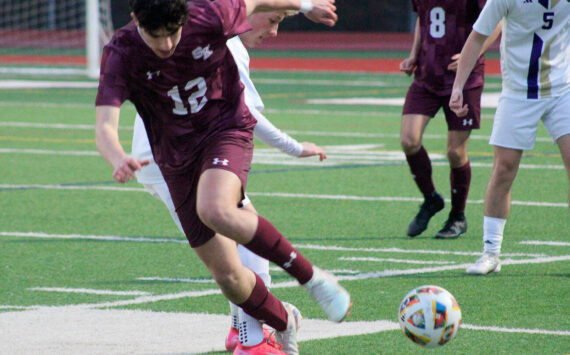 Luke Caputo/Kitsap News Group photos
Xander Zusy of South Kitsap fights for the ball in a 9-1 loss to the Sumner Spartans April 7 in Port Orchard.