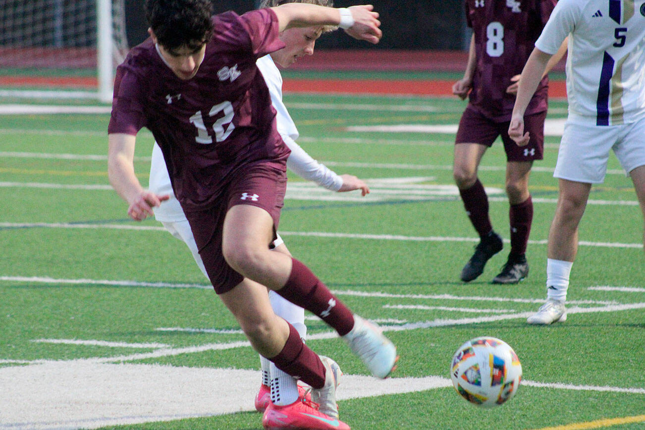 Luke Caputo/Kitsap News Group photos
Xander Zusy of South Kitsap fights for the ball in a 9-1 loss to the Sumner Spartans April 7 in Port Orchard.