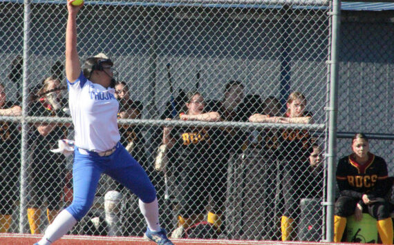 Luke Caputo/Kitsap News Group photos
Trojan Brenda Morrison winds up a pitch in a 5-1 Olympic win over the Kingston Buccaneers April 14 at the Kitsap County Fairgrounds.
