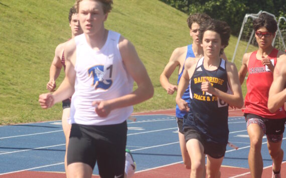 Luke Caputo/Kitsap News Group
Bremerton Knight Dallin Anderson (front) and Bainbridge Spartan Ignacio Llorens (back) compete in the 800M event at districts, May 21 at Bremerton High School.