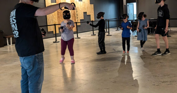 Sean Ong courtesy photos 
Campers wear VR headsets and ‘travel’ as a group to explore topics like the solar system, atoms and molecules, and natural environments.