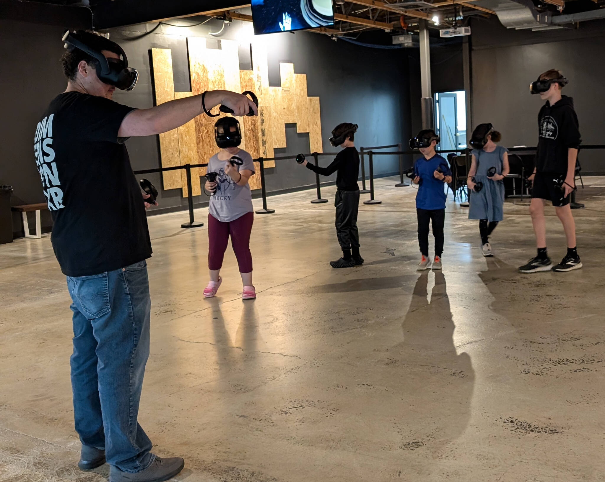 Sean Ong courtesy photos 
Campers wear VR headsets and ‘travel’ as a group to explore topics like the solar system, atoms and molecules, and natural environments.