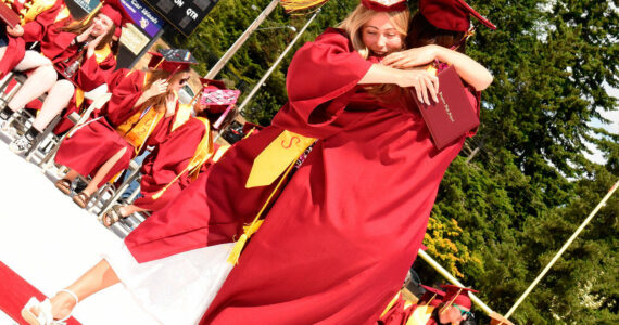 Katrina Daroff/Kitsap News Group photos
Two Kingston High School graduates hug in celebration after receiving their diplomas.