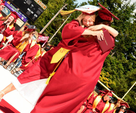 Katrina Daroff/Kitsap News Group photos
Two Kingston High School graduates hug in celebration after receiving their diplomas.