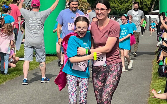Jordan Duncan courtesy photo
Arya (right) and Kristina Sowers cross the finish line of the Girls on the Run 5K event at the Kitsap County Fairgrounds.