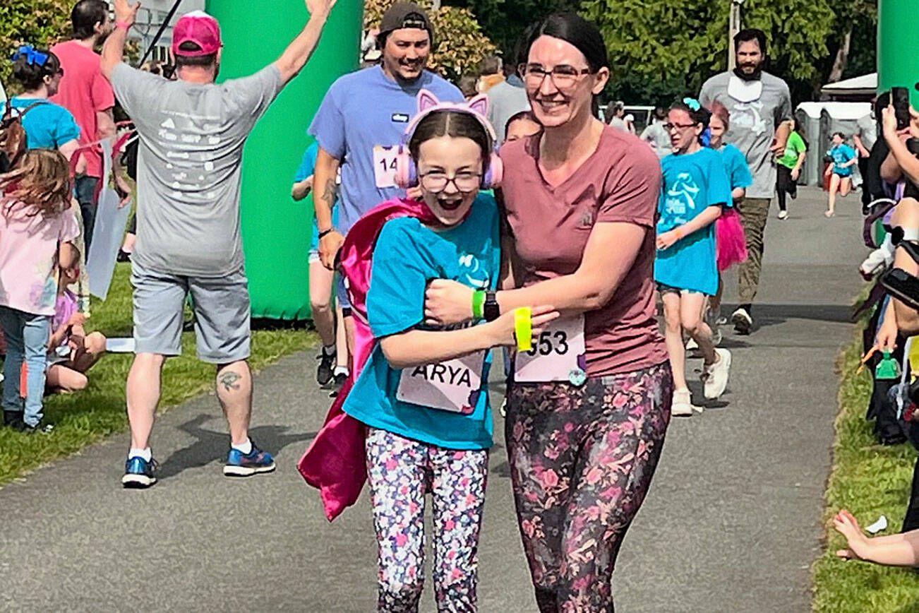 Jordan Duncan courtesy photo
Arya (right) and Kristina Sowers cross the finish line of the Girls on the Run 5K event at the Kitsap County Fairgrounds.