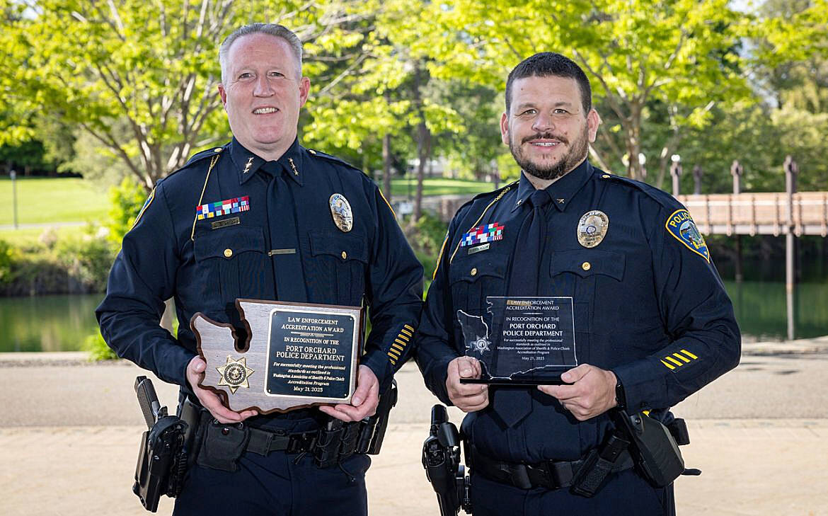 POPD courtesy photo
Port Orchard police chief Matt Brown (left) and deputy chief Andy Brandon hold accreditation plaques awarded to the force by the Washington Association of Sheriffs and Police Chiefs.
