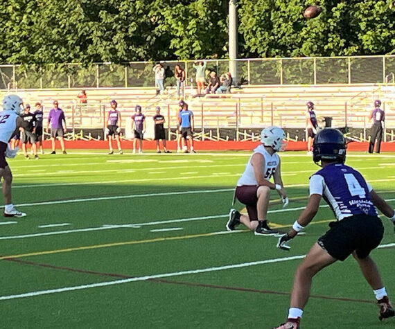 Luke Caputo/Kitsap News Group
SK quarterback Franklin Fox throws a pass July 2 in a 7 on 7 football scrimmage in Port Orchard.