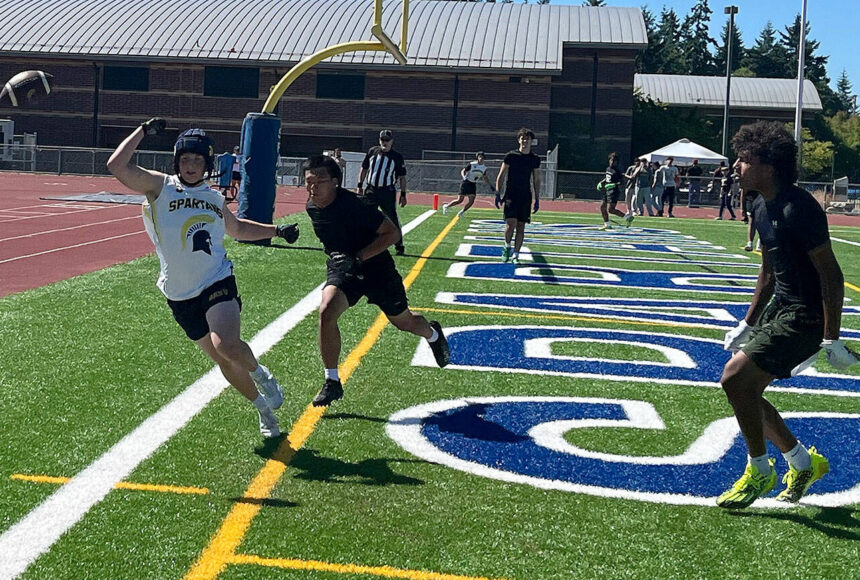 <p>Luke Caputo/Kitsap News Group photos</p>
                                <p>Bainbridge wide receiver Rowan Meek attempts to make a play on an incoming pass with a Mount Tahoma defender draped all over him in the 7 on 7 Battle at the Bay Tournament July 12 at Bainbridge High School.</p>