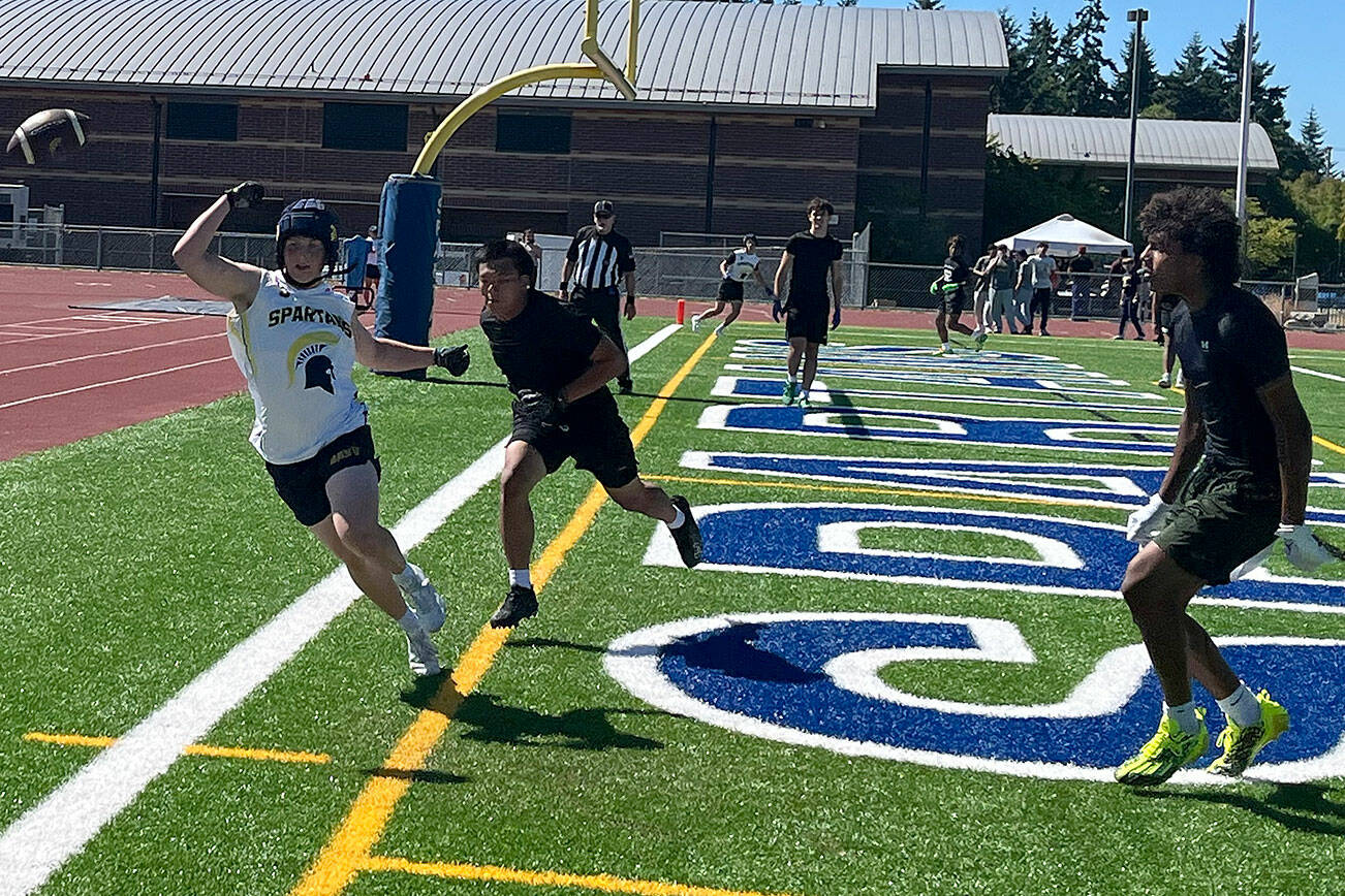 Luke Caputo/Kitsap News Group photos
Bainbridge wide receiver Rowan Meek attempts to make a play on an incoming pass with a Mount Tahoma defender draped all over him in the 7 on 7 Battle at the Bay Tournament July 12 at Bainbridge High School.