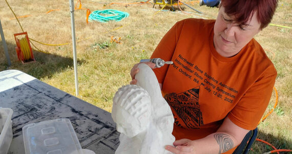 Mark Storer/Kitsap News Group photos
Cyra Jane, Stone Carver Symposium director and sculptor, works with a marble statuette while she has downtime.