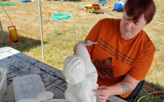 Mark Storer/Kitsap News Group photos
Cyra Jane, Stone Carver Symposium director and sculptor, works with a marble statuette while she has downtime.