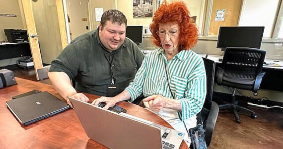 Mike De Felice/Kitsap News Group
Joan Walz, of Poulsbo, learns the basics about her computer during a senior technology class alongside Kitsap Tech Support instructor Colin Waters.
