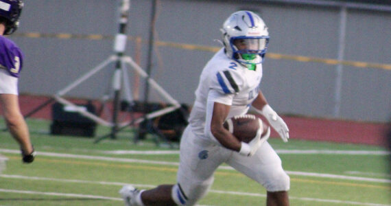 Luke Caputo/Kitsap News Group photos
Trojan running back Chace Webster rushed for over 200 yards and scored three touchdowns in a 27-14 Olympic win over the North Kitsap Vikings Sept. 18 in Poulsbo.