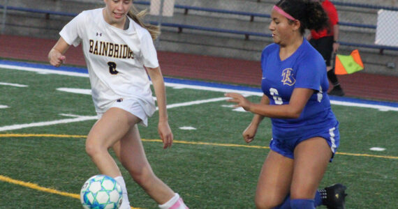 Luke Caputo/Kitsap News Group photos
Spartan Maggie Dunstan and Knight Akina Pritchard compete for the ball in a 6-0 Bainbridge win Sept. 23 in Bremerton.