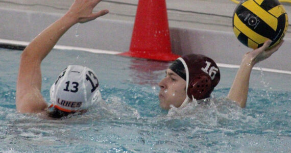 Luke Caputo/Kitsap News Group photos
William Spindler of SK attempts to pass the ball in a 19-5 Wolves win over the Lakes Lancers Oct. 13 in Port Orchard.