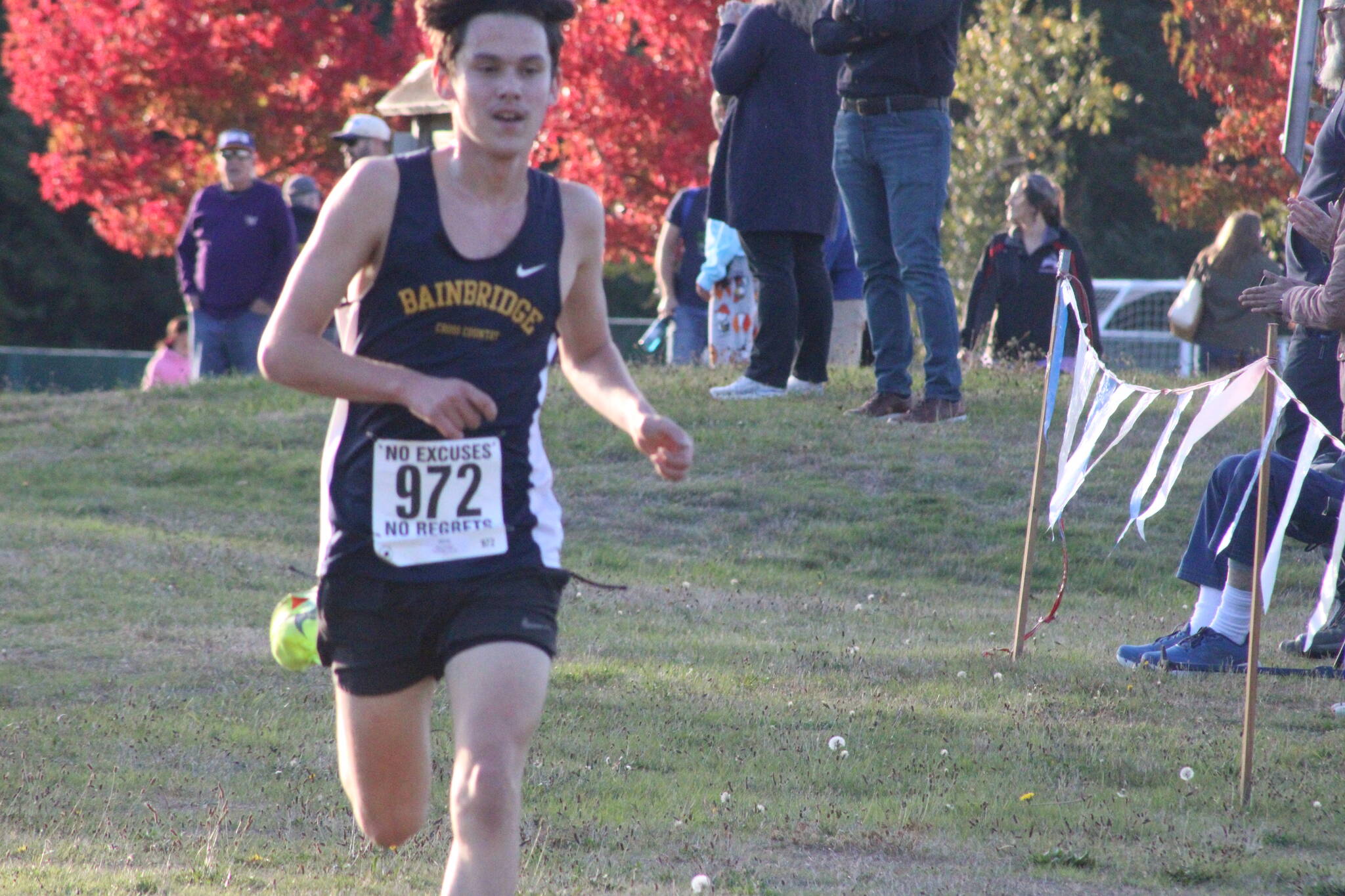 Luke Caputo/Kitsap News Group photos
Spartan Ryan Dodge crosses the finish line in the boys’ 5K event, placing first in the Olympic League Cross Country meet at Battle Point Park on Bainbridge Island Oct. 15.