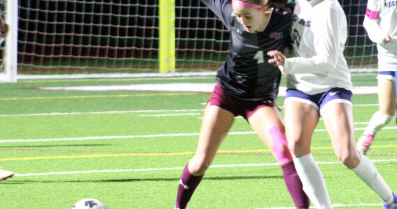Luke Caputo/Kitsap News Group photos
Mia Smalley of SK fights for the ball with a Rogers defender in a 0-0 draw Oct. 23 in Port Orchard.