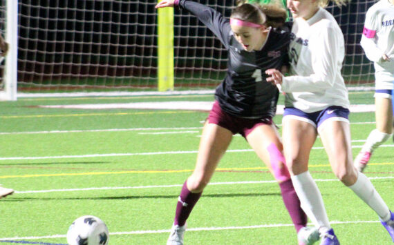 Luke Caputo/Kitsap News Group photos
Mia Smalley of SK fights for the ball with a Rogers defender in a 0-0 draw Oct. 23 in Port Orchard.