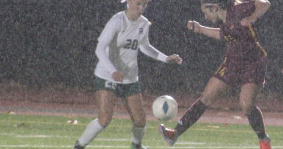 Luke Caputo/Kitsap News Group
Buccaneer Quincy Adkins attempts to dribble the ball past a Port Angeles defender in a 4-2 Kingston home loss to the Roughriders Oct. 28.