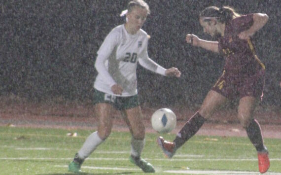 Luke Caputo/Kitsap News Group
Buccaneer Quincy Adkins attempts to dribble the ball past a Port Angeles defender in a 4-2 Kingston home loss to the Roughriders Oct. 28.