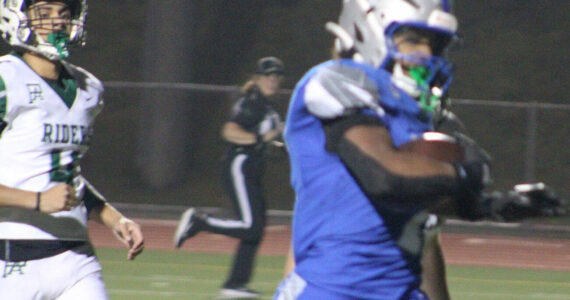 Luke Caputo/Kitsap News Group
Olympic running back Chace Webster broke the school’s single-season rushing record Oct. 30 in a 46-6 Trojan home win over Port Angeles.