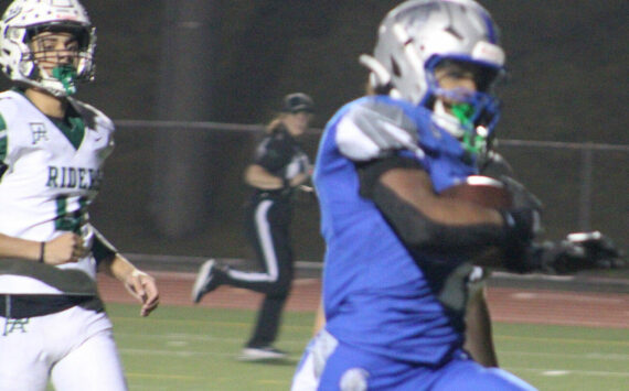 Luke Caputo/Kitsap News Group
Olympic running back Chace Webster broke the school’s single-season rushing record Oct. 30 in a 46-6 Trojan home win over Port Angeles.