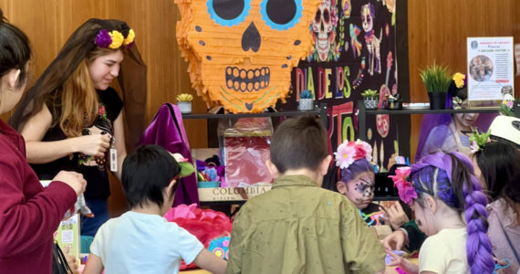 Britney Fletcher-West/Kitsap News Group photos
Children participate in piñata making during the Dia de Muertos festival Nov. 1.