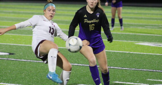 Luke Caputo/Kitsap News Group
SK sophomore midfielder Julia Hoisington attempts to kick the ball with a Puyallup defender in pursuit in a 2-0 loss to the Puyallup Vikings Nov. 4 in the second round of districts in Federal Way.