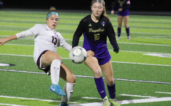 Luke Caputo/Kitsap News Group
SK sophomore midfielder Julia Hoisington attempts to kick the ball with a Puyallup defender in pursuit in a 2-0 loss to the Puyallup Vikings Nov. 4 in the second round of districts in Federal Way.