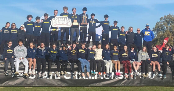Anne Howard courtesy photo
The Bainbridge Spartans celebrate the boys team’s first-place finish at the 2A state cross country championships at Sun Willows Golf Course in Pasco Nov. 8.
