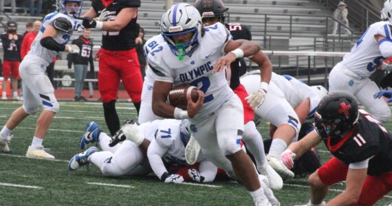 Luke Caputo/Kitsap News Group
Trojan running back Chace Webster rushes for a long gain in a 45-13 Olympic road loss to the Archbishop Murphy Wildcats Nov. 15 in the first round of the 2A state football tournament.