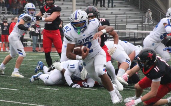 Luke Caputo/Kitsap News Group
Trojan running back Chace Webster rushes for a long gain in a 45-13 Olympic road loss to the Archbishop Murphy Wildcats Nov. 15 in the first round of the 2A state football tournament.