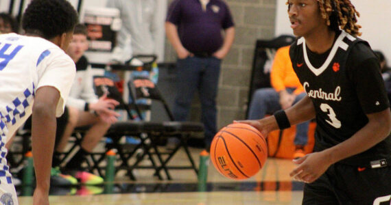 Luke Caputo/Kitsap News Group photos
Cougar Larry Williams III brings the ball to the top of the key in a 63-46 CK home win over the Olympic Trojans Nov. 29.