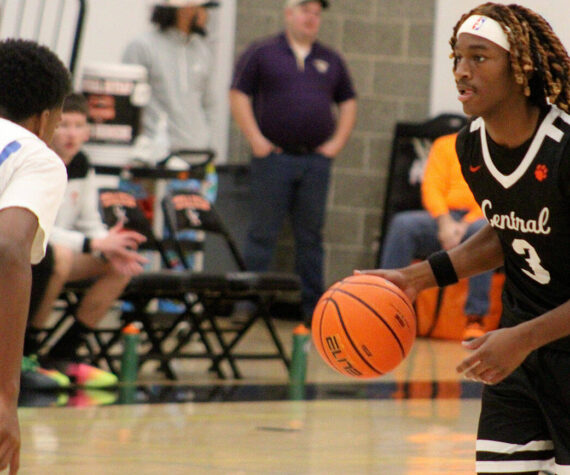 Luke Caputo/Kitsap News Group photos
Cougar Larry Williams III brings the ball to the top of the key in a 63-46 CK home win over the Olympic Trojans Nov. 29.