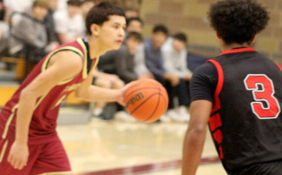 Luke Caputo/Kitsap News Group photos
Buccaneer Sylis Sullivan looks to make a play in a 57-55 Kingston home win over the Orting Cardinals Dec. 1.