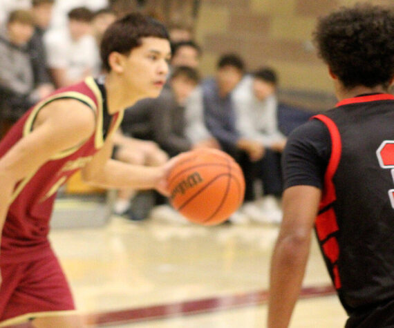 Luke Caputo/Kitsap News Group photos
Buccaneer Sylis Sullivan looks to make a play in a 57-55 Kingston home win over the Orting Cardinals Dec. 1.