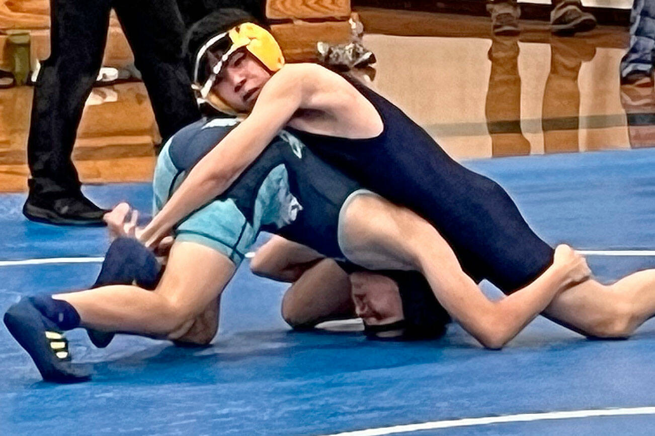 Luke Caputo/Kitsap News Group photos
Bremerton Knight Kode Kulrat pins a Gig Harbor wrestler in a meet Dec. 11 at Bainbridge High School.