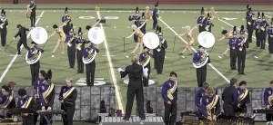 The North Kitsap High School Marching Band     performs in 2011. Band booster clubs at North Kitsap and Kingston high schools will have to raise more money this year after cuts were made to music instructors’  building and transportation funds.