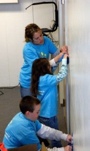 Comcast employee Nicole Cuevas and her children