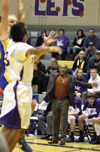 North Kitsap Viking coach Tony Chisholm watches as NK's Jacob Hill works to block a Bremerton offensive drive during the first half of Tuesday's game in the North Kitsap High School gymnasium.