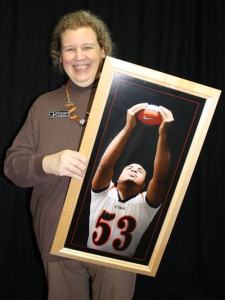 Victoria Quinn poses with a senior portrait she created.