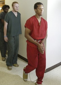 David Adams (in red) entered a not guilty plea Monday in Kitsap County Superior Court regarding the death of Richard Hugh Jones Jr. of Kingston.