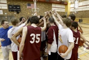 The Kingston boys varsity basketball team celebrated its first win in the school's three-year history with a dramatic overtime win in Port Angeles.