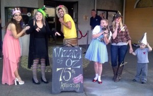 Dragonfly Cinema staff members dress up for a 75th anniversary screening of “The Wizard of Oz.”